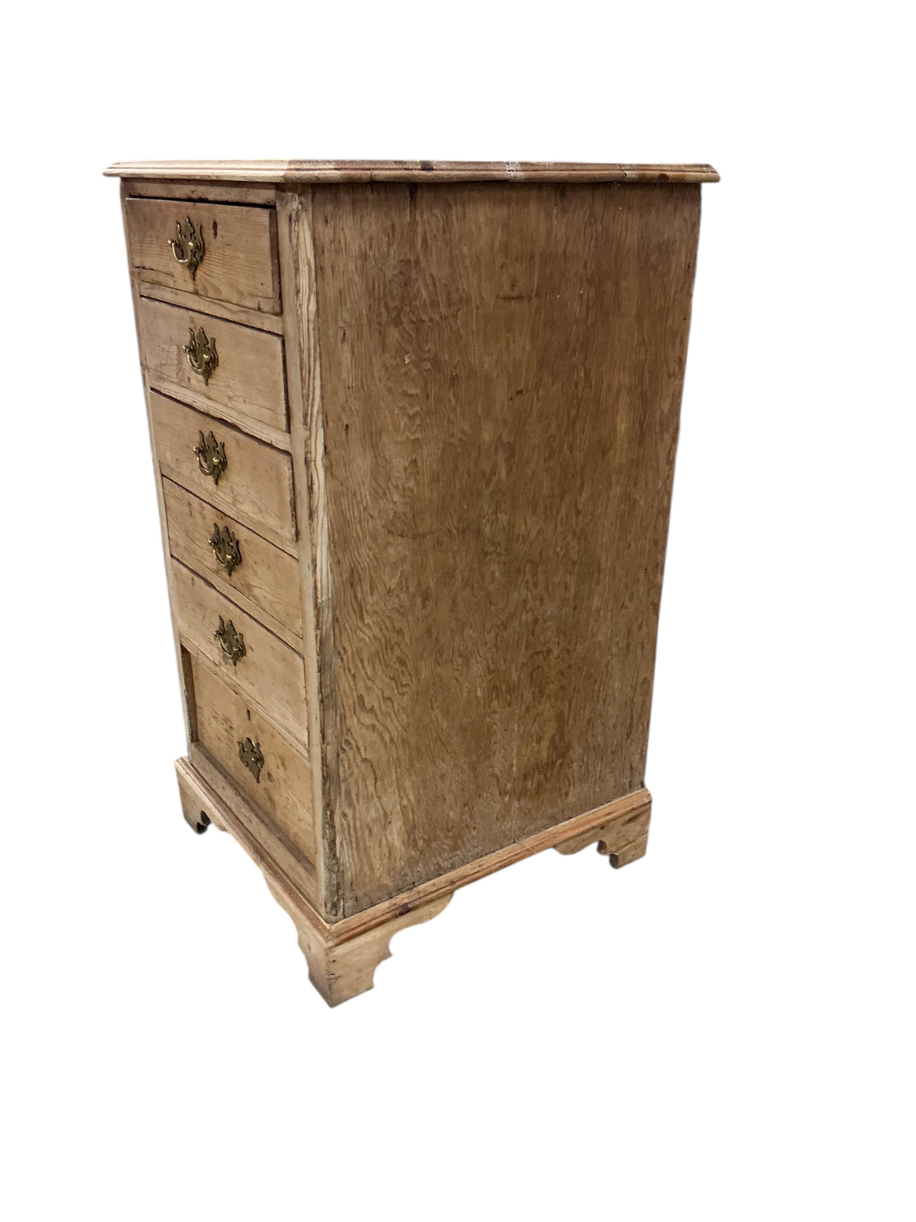 An early 19th century narrow pine chest of six drawers, width 54cm, depth 59cm, height 103cm